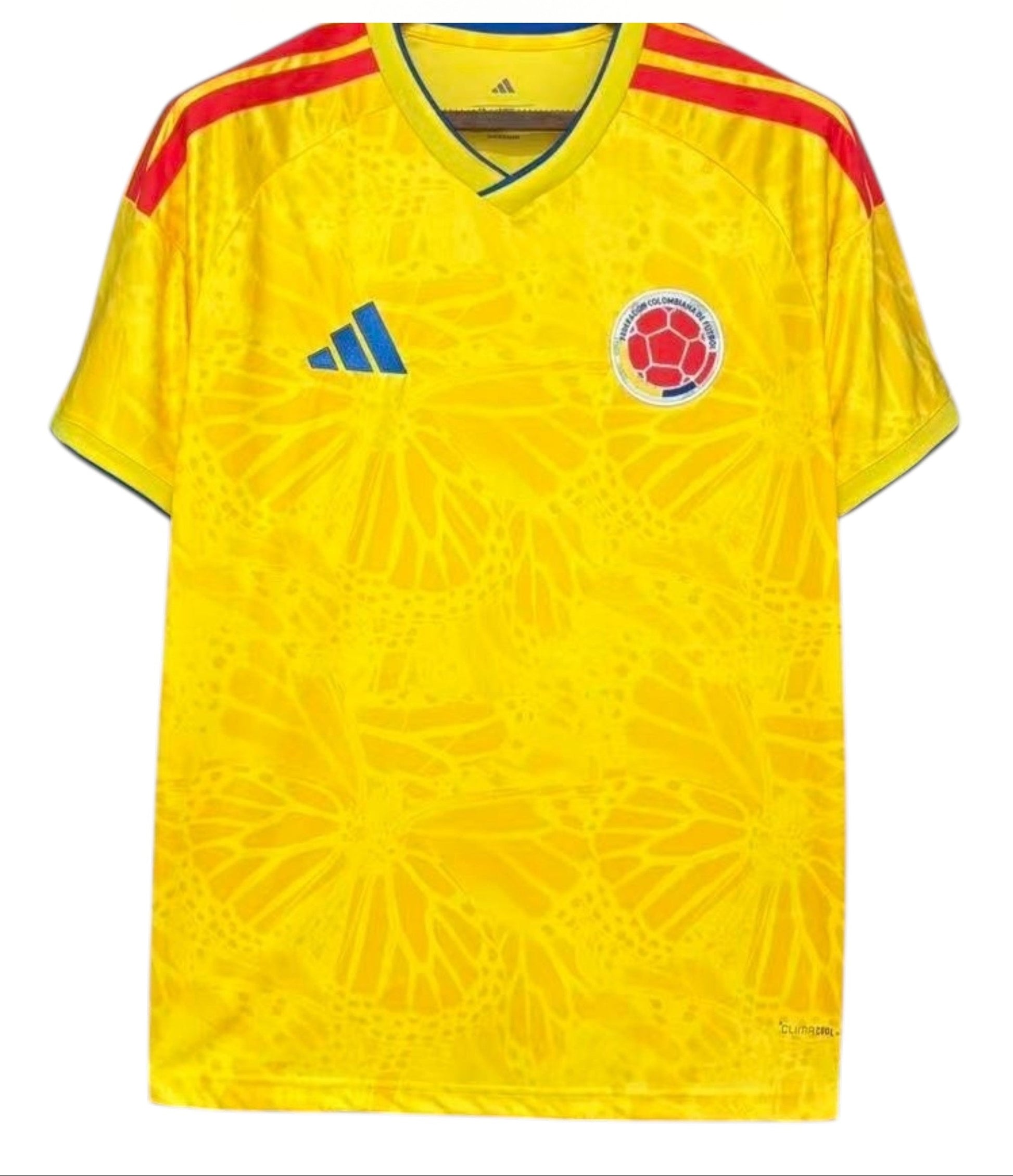 Yellow soccer jersey with red shoulders and Colombia national team logo, branded with Adidas, on a white background.