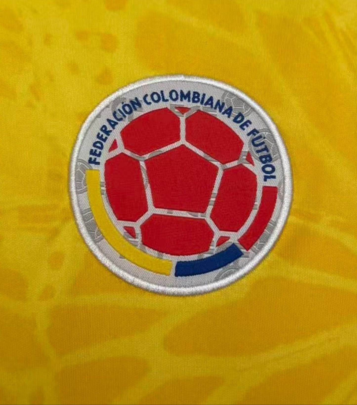 Colombian football federation logo on a yellow background with Samba Street Co. branding.