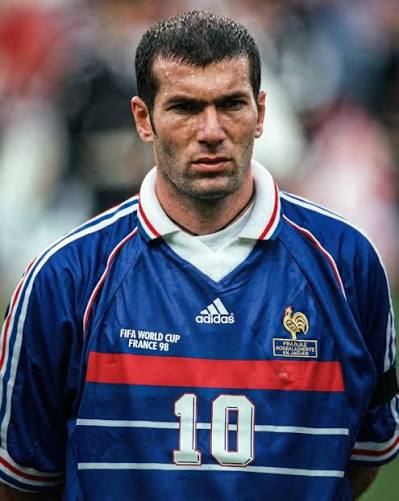 Zinedine Zidane wearing the France 1998 home football shirt